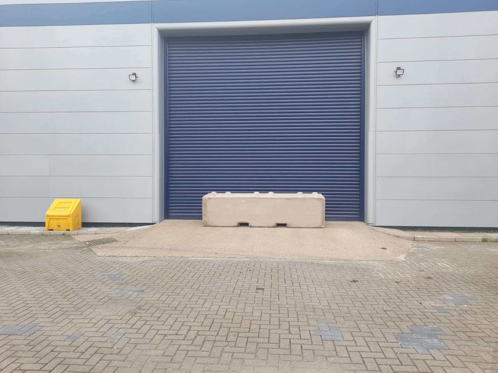 xl concrete barrier blocking a warehouse