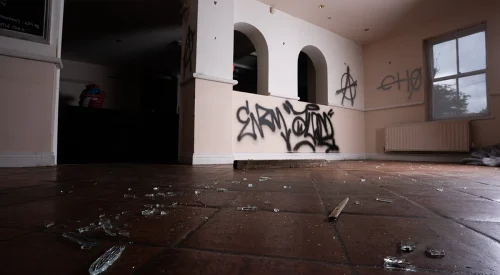 an empty building with graffiti